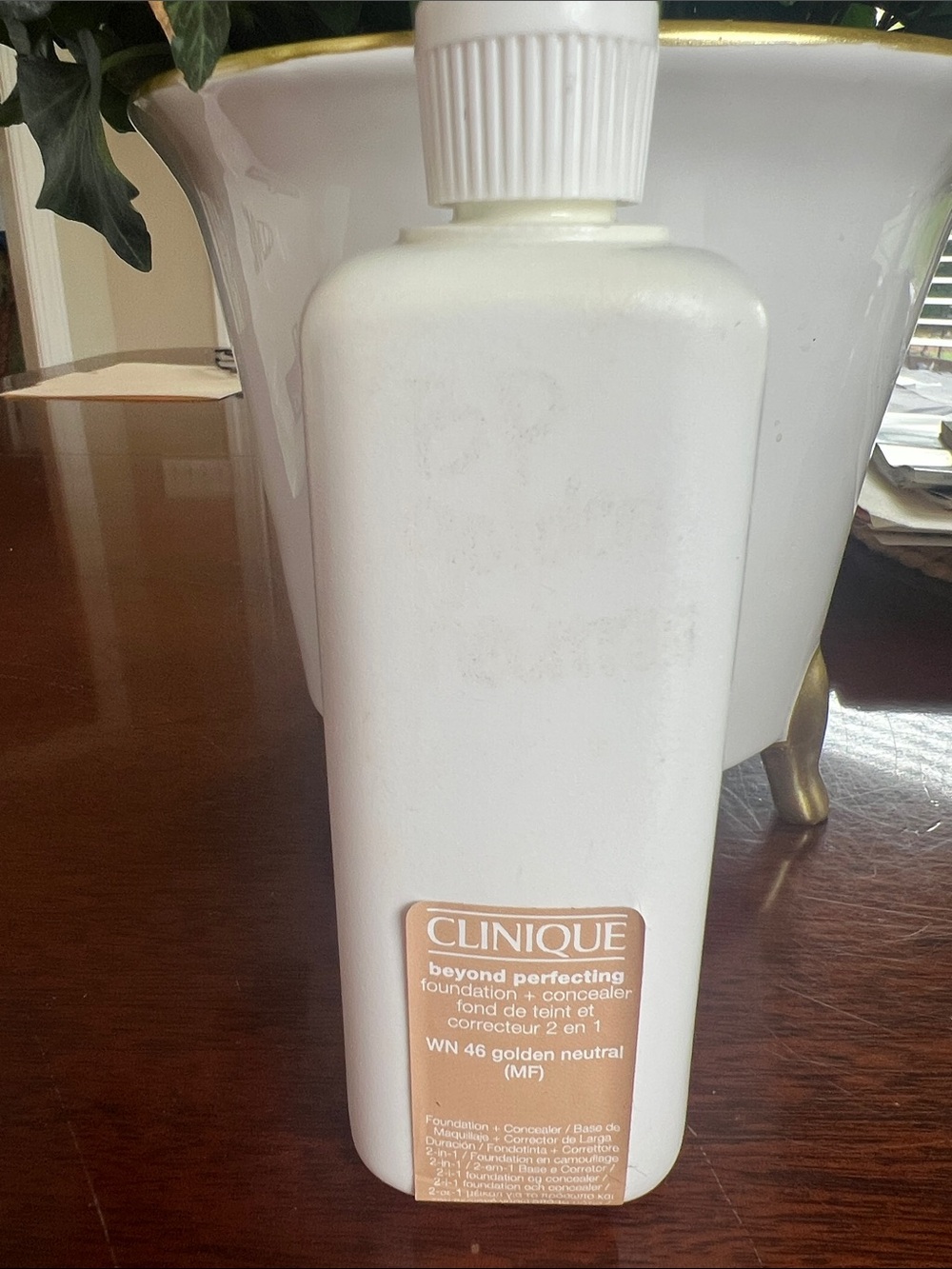 Clinique foundation/concealer bottle in white with beige label